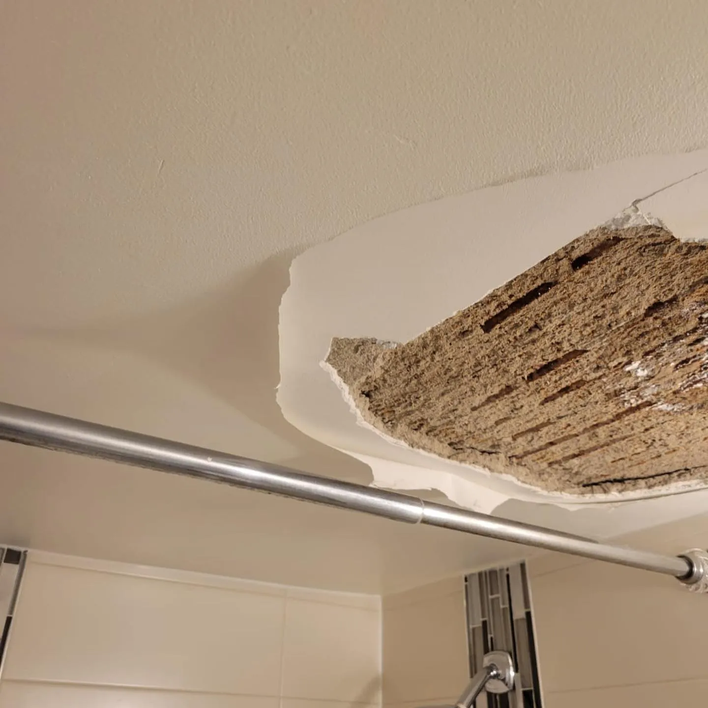 Corner damage showing mold growth and deteriorated drywall from water damage and moisture exposure